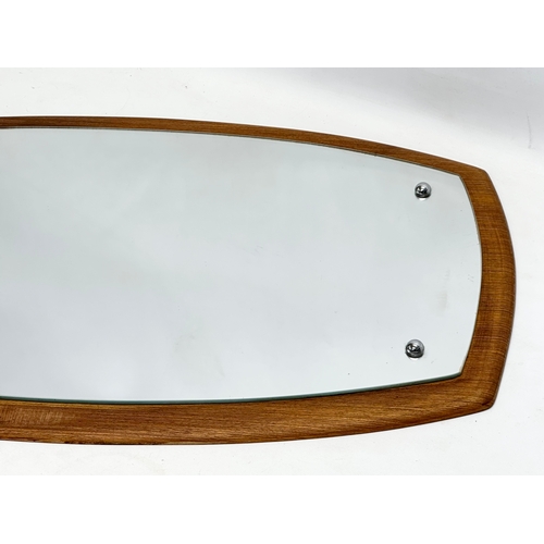 1170 - A Mid Century teak framed mirror. 75x44cm