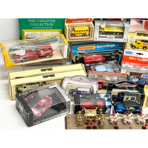 645 - A large collection of model cars and trucks etc.