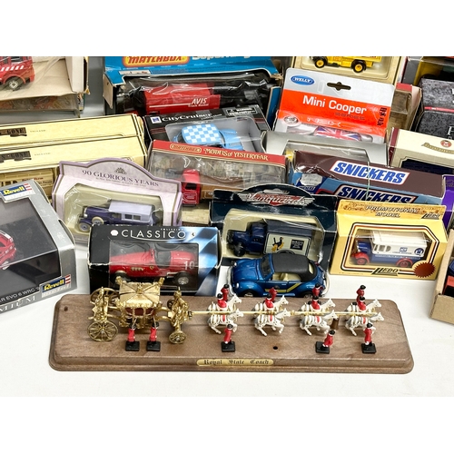 645 - A large collection of model cars and trucks etc.