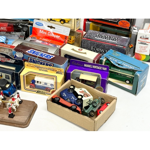 645 - A large collection of model cars and trucks etc.