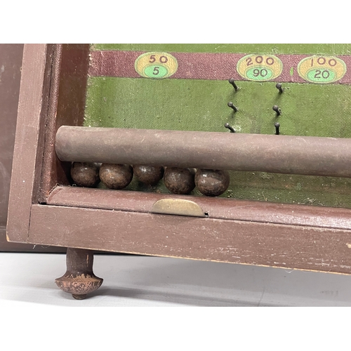 648 - A vintage Corinthian 30 bagatelle game board.