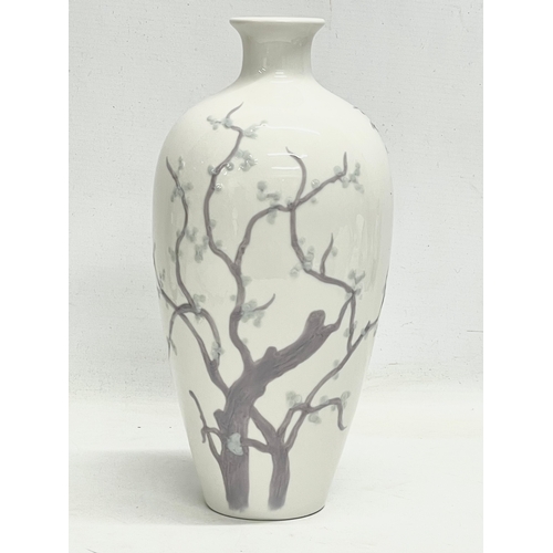 105B - A Lladro ‘Tree of Life’ porcelain vase. 29.5cm