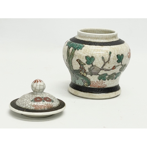 299X - A 20th century Chinese crackle glazed ginger jar with lid. 13.5cm