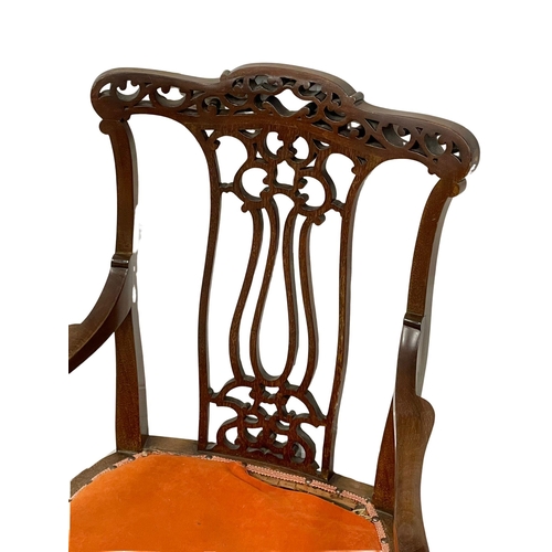 1002 - An Edwardian mahogany parlour chair. (2)