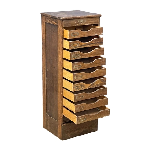 1041 - An Edwardian oak tambour door filing cabinet. 45x40x120cm (8)