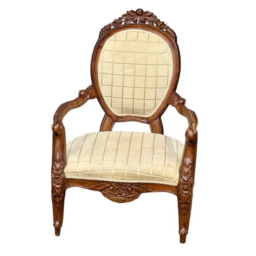 1044 - A Victorian style gents open armchair. (7)