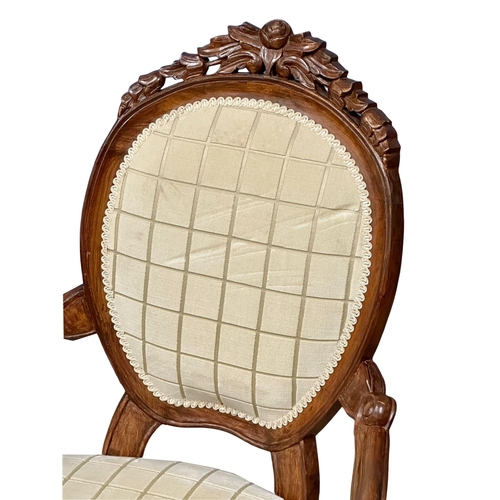 1044 - A Victorian style gents open armchair. (7)