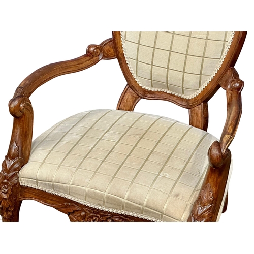 1044 - A Victorian style gents open armchair. (7)