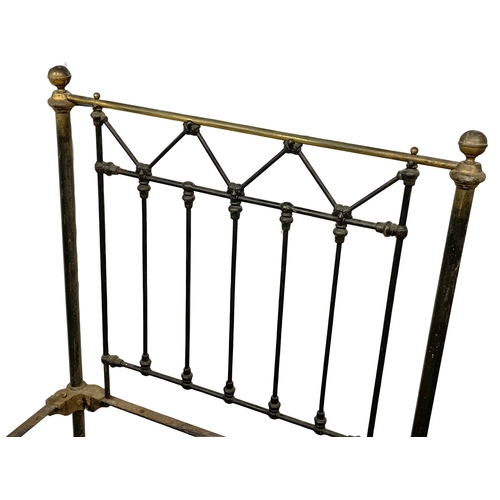 1049 - A Victorian cast iron and brass single bed. 110.5x208x132cm