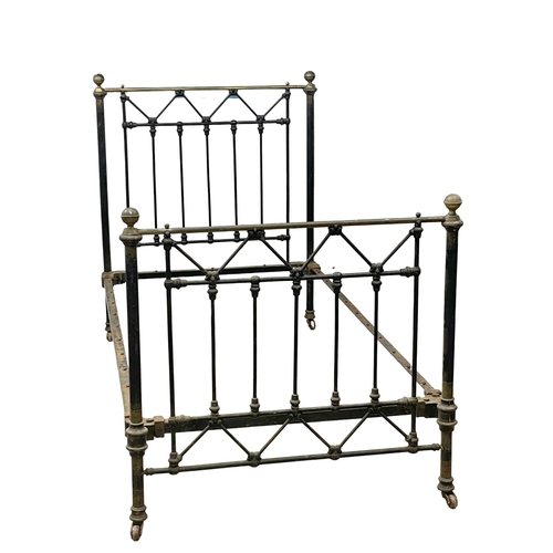 1049 - A Victorian cast iron and brass single bed. 110.5x208x132cm