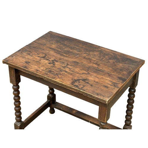 1072 - A late Victorian oak side table Barley Twist legs. Circa 1890. 74x50.5x73cm (3)