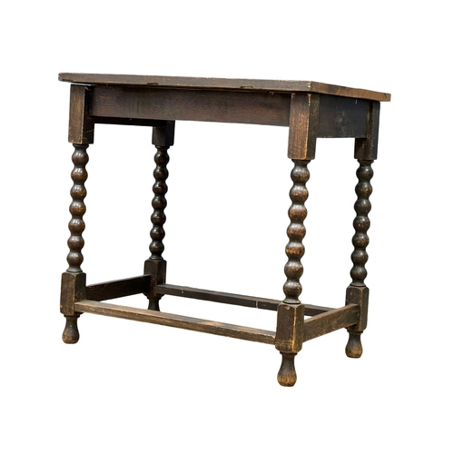 1072 - A late Victorian oak side table Barley Twist legs. Circa 1890. 74x50.5x73cm (3)