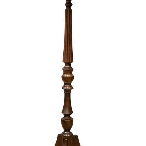 1073 - A Regency style mahogany torchiere. 100cm (2)