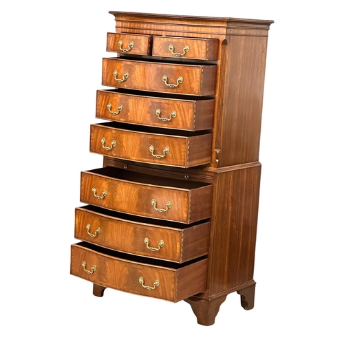 1076 - A vintage George III style mahogany serpentine front tallboy chest of drawers with brushing slide an... 