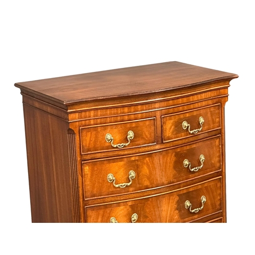 1076 - A vintage George III style mahogany serpentine front tallboy chest of drawers with brushing slide an... 