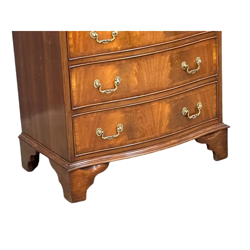 1076 - A vintage George III style mahogany serpentine front tallboy chest of drawers with brushing slide an... 