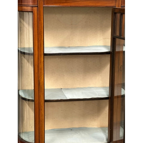 1080 - An Edwardian inlaid mahogany bow front display cabinet. 91x33x171cm (4)