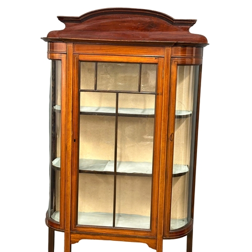 1080 - An Edwardian inlaid mahogany bow front display cabinet. 91x33x171cm (4)