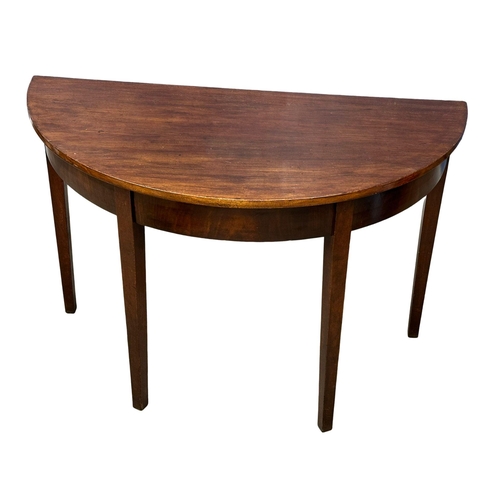 1081 - A George III mahogany D-End side table. Circa 1800. 109x54x72cm (11)