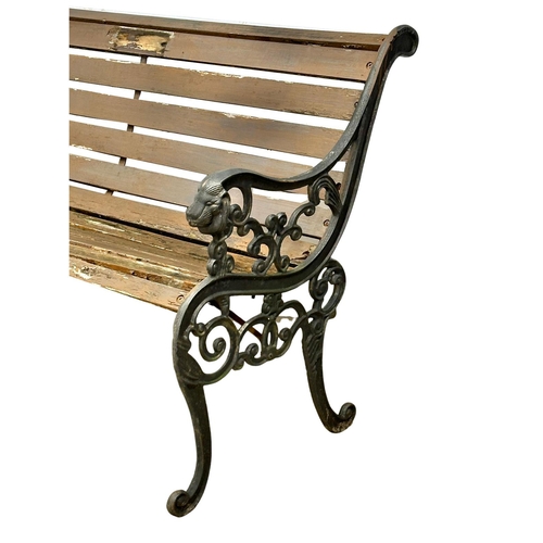 1087 - A vintage garden bench with cast iron ends. 126cm (7)