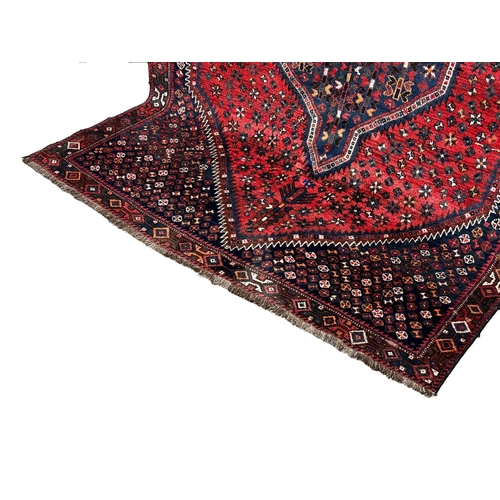 1089 - A large vintage Iranian hand knotted wool pile rug. 159x267cm