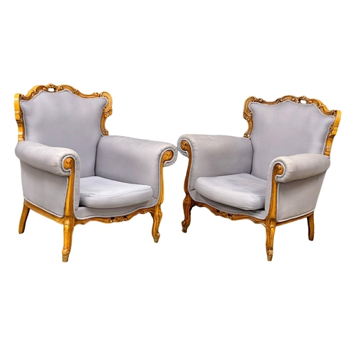 1092 - A pair of large Italian carved framed armchairs. (7)