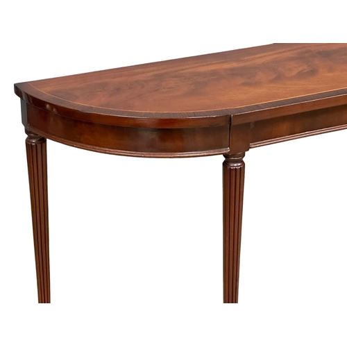 1104 - A Regency style inlaid mahogany console table with rosewood crossbanding on reeded legs. 123x30x72cm... 