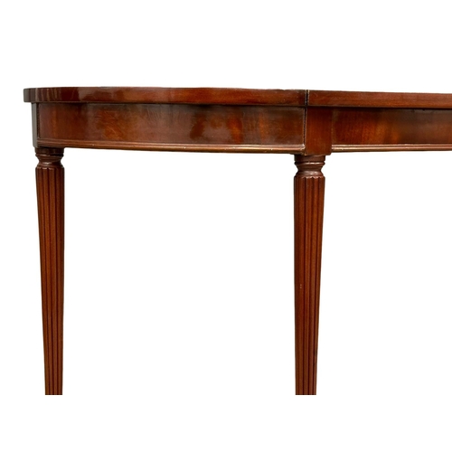 1104 - A Regency style inlaid mahogany console table with rosewood crossbanding on reeded legs. 123x30x72cm... 