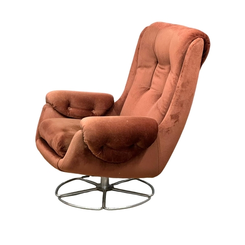 1120 - A Mid Century swivel armchair on chrome base. 1970. (6)