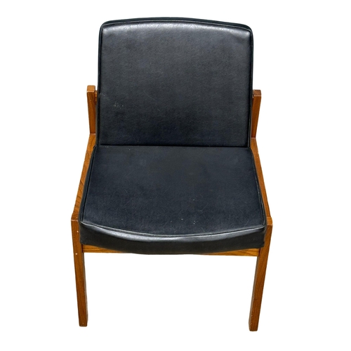 1123 - A Mid Century teak and black vinyl desk chair. (6)