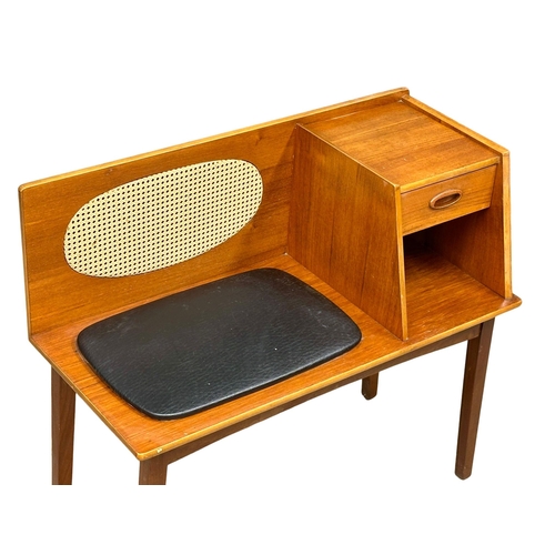 1125 - A 1960’s Mid Century teak telephone bench with black vinyl seat. 83x38x74cm (6)