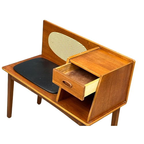 1125 - A 1960’s Mid Century teak telephone bench with black vinyl seat. 83x38x74cm (6)