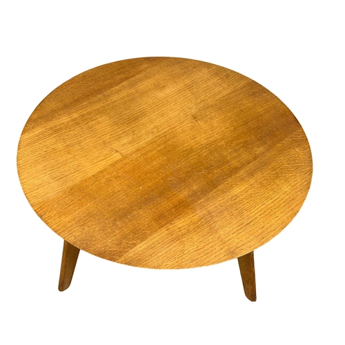 1126 - A 1950’s Mid Century oak circular coffee table. 73x46cm (4)