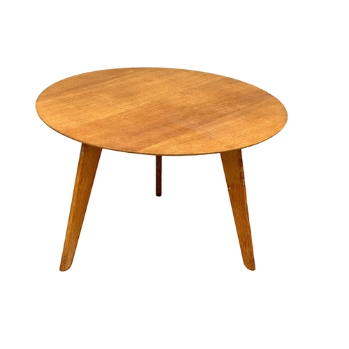 1126 - A 1950’s Mid Century oak circular coffee table. 73x46cm (4)