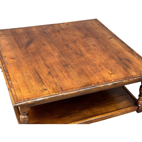 1134 - A large elm and birch country house 2 tier coffee table. 124x122x47.5cm (5)