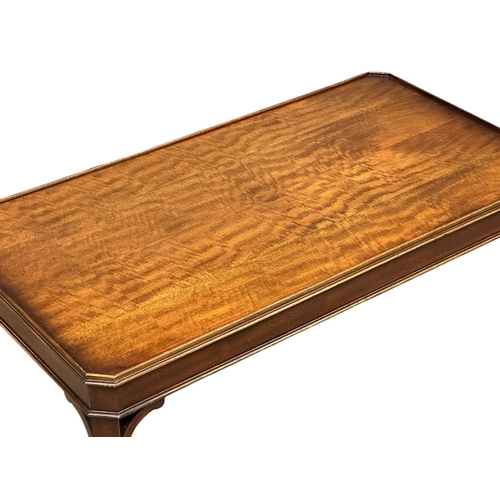 1137 - A mahogany coffee table. 108x57x52cm (5)