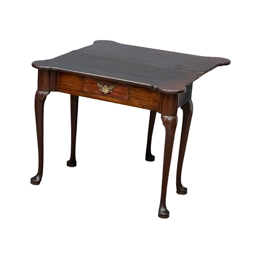 1142 - An 18th century late George II mahogany turnover tea table with original brass handle. Circa 1750. 8... 