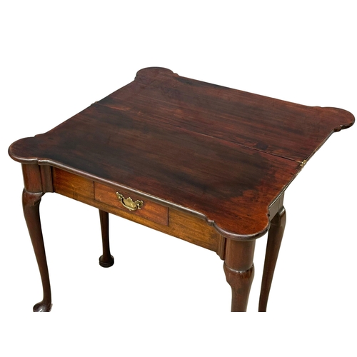 1142 - An 18th century late George II mahogany turnover tea table with original brass handle. Circa 1750. 8... 