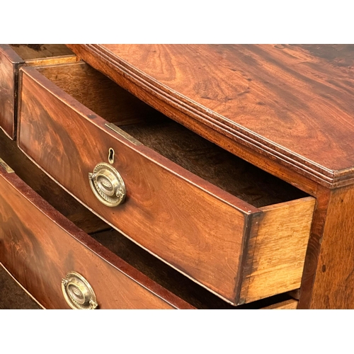 1150 - A Regency mahogany bow front chest of drawers on splayed feet. Circa 1810. 103.5x54x101.5cm (6)