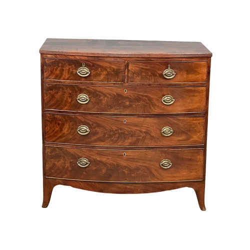 1150 - A Regency mahogany bow front chest of drawers on splayed feet. Circa 1810. 103.5x54x101.5cm (6)