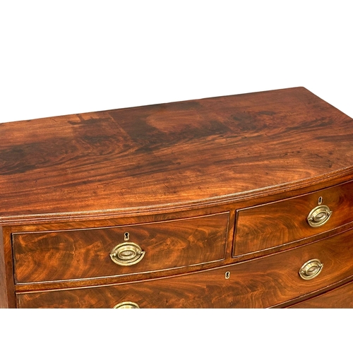 1150 - A Regency mahogany bow front chest of drawers on splayed feet. Circa 1810. 103.5x54x101.5cm (6)