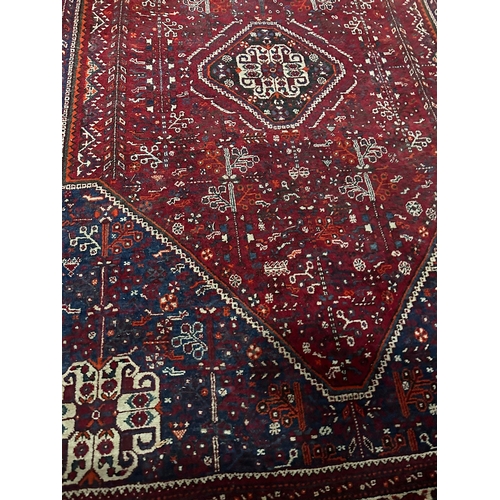 1163 - A large vintage Middle Eastern hand knotted rug. 189x268cm