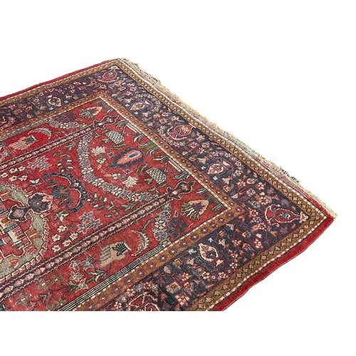 1184 - A vintage Middle Easter hand knotted rug.