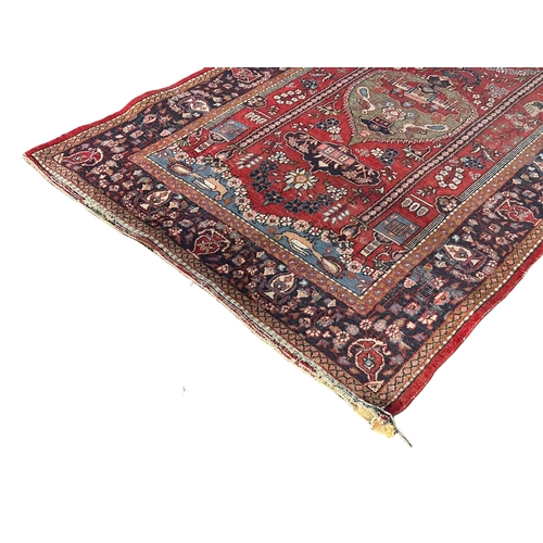 1184 - A vintage Middle Easter hand knotted rug.