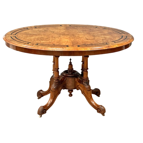 1196 - A Victorian inlaid Burr Walnut tilt top breakfast table/ dining table on cabriole legs. 120x89x73cm ... 