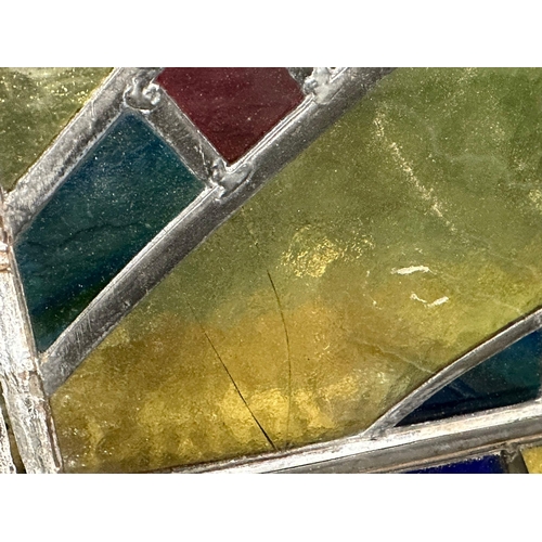 211U - A set of 12 early 20th century stained glass panels 35x49.5cm each.