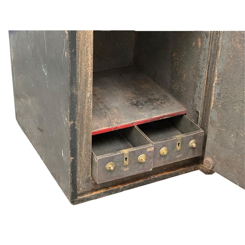 65G - An early 20th century safe. Cyrus Price & Co LTD, Wolverhampton. Little & McClean LTD, Belfast. 51x5... 