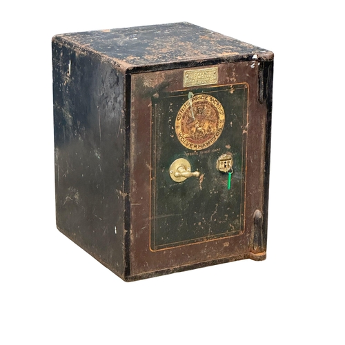 65G - An early 20th century safe. Cyrus Price & Co LTD, Wolverhampton. Little & McClean LTD, Belfast. 51x5... 