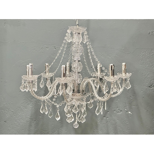 73 - A pair of large plastic chandeliers.