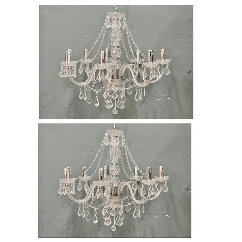 73 - A pair of large plastic chandeliers.